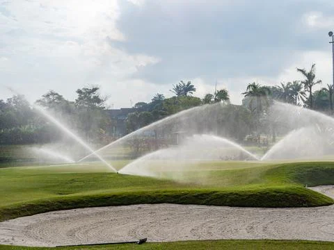 Irrigation of golf course Stock Photos