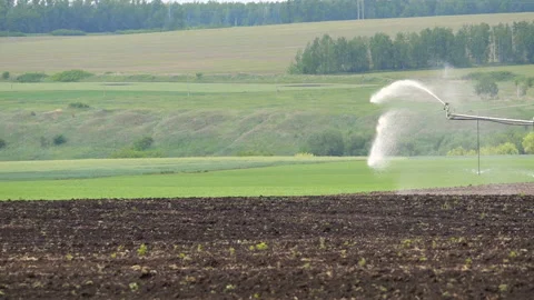 Irrigation pivot system watering a field, slow motion Stock-Footage 169367775