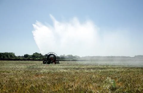 Irrigation pivot watering the Fields Stock Photos
