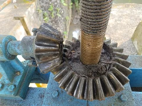 An irrigation sluice gate located on a small dam. Stock Photos