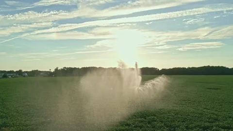 Irrigation system in function watering agricultural plants. Sprinklers Video stock 315627289