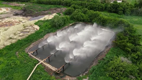 Irrigation of the territory with a special installation Stock Footage 168684370