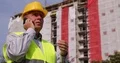 Irritated Engineer Phone Talking Decision Give Orders Construction Workers Team 4k or 4k+ Resolution