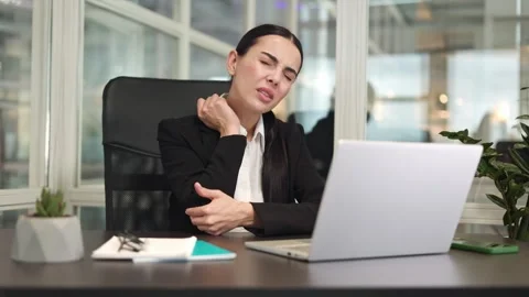 Irritated lady manager using laptop and feeling severe pain in elbow in office Stock Footage 256965475