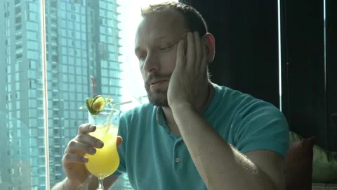 Irritated man checking time and waiting for someone in the cafe Stock Footage 93223073