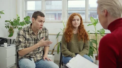 Irritated young couple having session with therapist Stock Footage 142291751