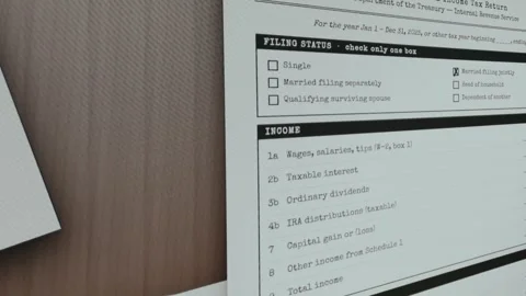 IRS Form 1040, stamp APPROVED being applied Stock Footage 333445658