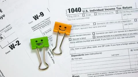 IRS U.S. Tax Forms and Smile Binder Clips Stock Photos