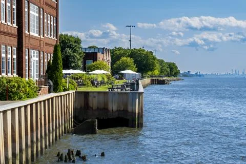 Irvingtons waterfront features riverside dining, historic brick architecture. Stock Photos