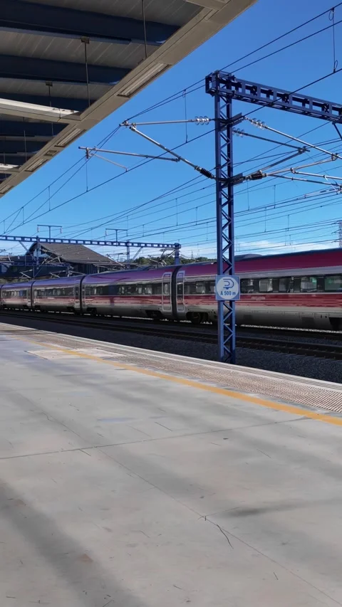 IRYO high-speed train passing through the station without stopping. Slowmotion Stock Footage 255291982