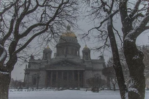 Isaak Cathedral between trees in St. Petersburg in winter Stock Photos