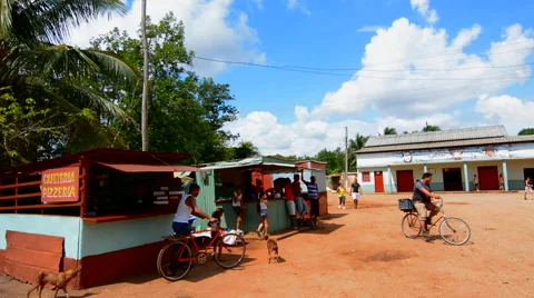 Isabel Cuba small town with dirt streets and local people relaxing and on bikes Stock-Footage 45206702