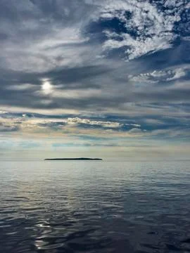 Isaland and clouds Stock Photos