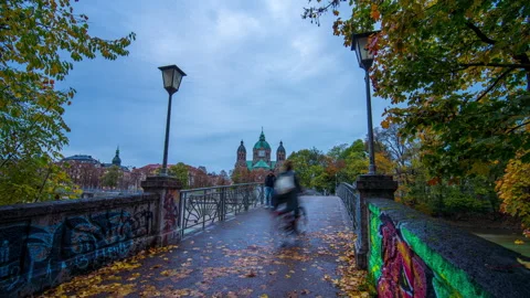 Isar river and St. Lukas Church, Munich, Germany sunset day to night timelapse Stock Footage 222927371