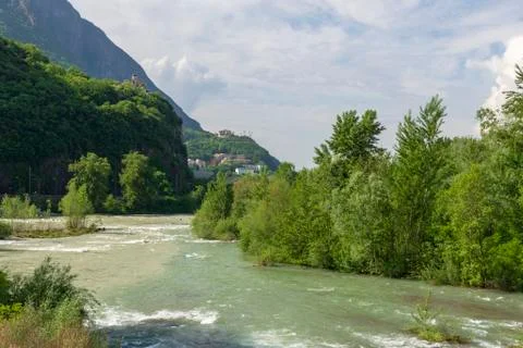 Isarco river in spring time with  a castle and a church high upp Stock Photos