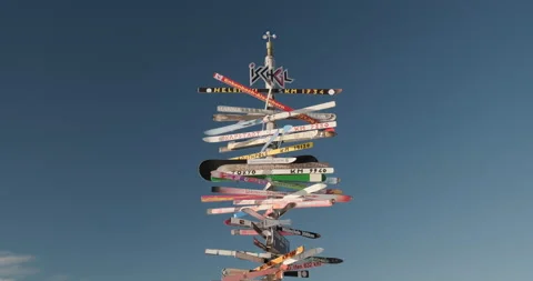 Ischgl signpost with old skis up on the slopes of Paznaun ski resort Video stock 232123137