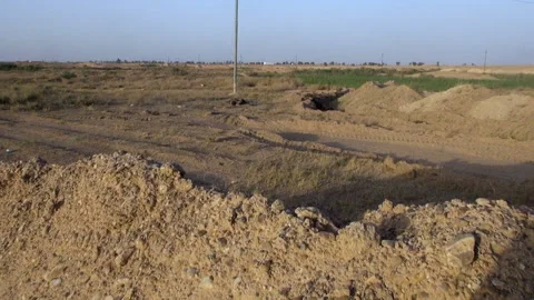 ISIL members' corpses in front of a captured ISIL site by Iraqi forces Stock Footage 148901417