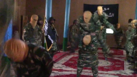 ISIS troops undergo training in a Darzab mosque in Afghanistan in this Stock Footage 100119278