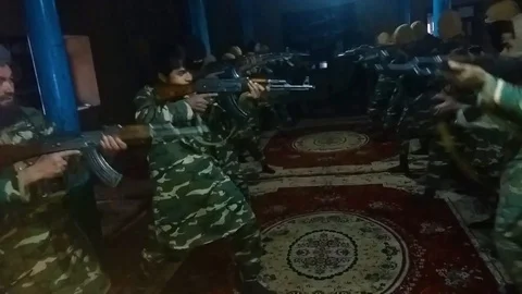 ISIS troops undergo weapons training in a Darzab mosque in Afghanistan in this Stock Footage 100119382