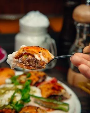 Iskender kebab at the fork Stock Photos