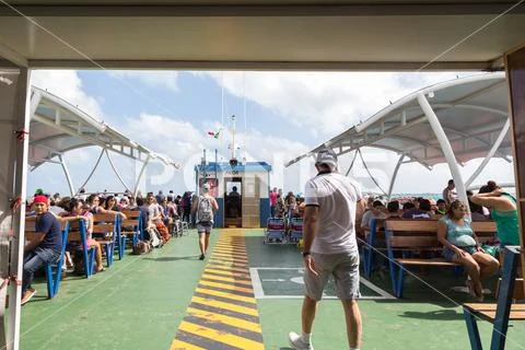 ISLA MUJERES, QR, MEXICO - FEB 11, 2018: The crowded deck of a ferry heading to Stock Photos