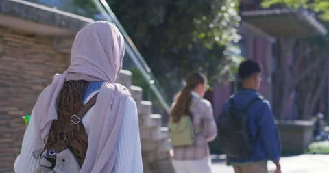 Islamic, back view or college student walking with bag for future or studying in Stock Footage 307775416