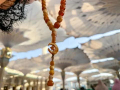 Islamic background with space for text. Blurred background of prayer beads .. Stock Photos