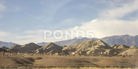 Islamic graveyard on hillside in rural Kyrgyzstan Stock Photos