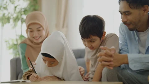 Islamic learning concept of 4k resolution. An Asian Muslim family is having.. Stock Footage 309302538