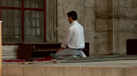 Islamic Man kneeling in prayer position at Mosque Stock Footage 48236901