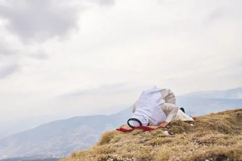 Islamic man praying Stock Photos