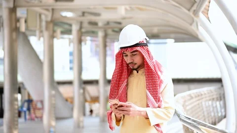 Islamic man using smartphones app organize schedule agenda  focus on hands holdi Stock Footage 124893226