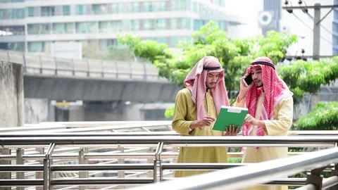 Islamic man using smartphones app organize schedule on business document folder  Stock Footage 137632072