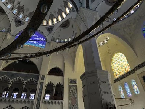Islamic mosque interior with arches stained glass windows Stock Photos
