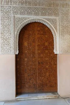 Islamic pattern on the massive doors of the Alhambra Palace, Grenada, Spain Stock Photos