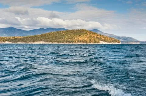 Island among the waves in the fall Stock Photos