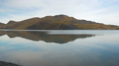 An island and its reflection on the waters of Patagonia in the morning, in Chile Stock Footage 237018360