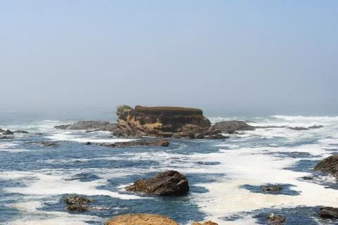 Island and Waves Stock Photos