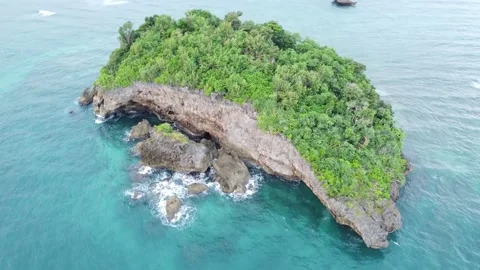 Island in blue waters Stock Footage 233183702