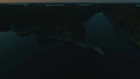 Island cliff in the shadows of a sunset Video stock 114004819