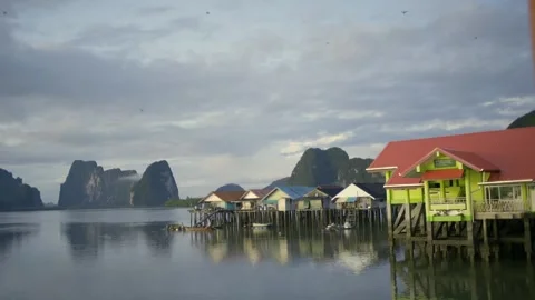 Island life view with boats floating house fishing koh panyee thailand Stock Footage 278317082