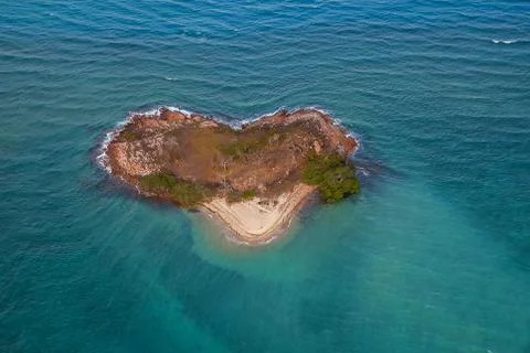 Island in ocean in heart shape Stock Photos