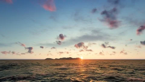 Island in the ocean on the sunset Stock Footage 98405260