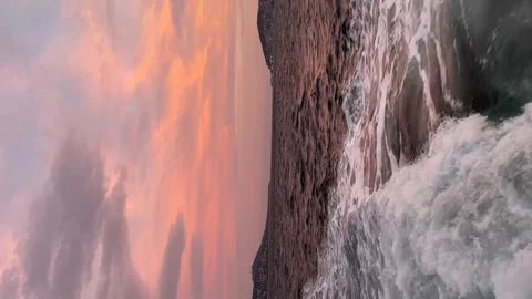 Island of red down and foam sea   - Vertical stock video Stock Footage 240327929