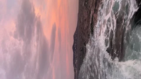Island of red down and foam sea   - Vertical stock video Stock Footage 240327931