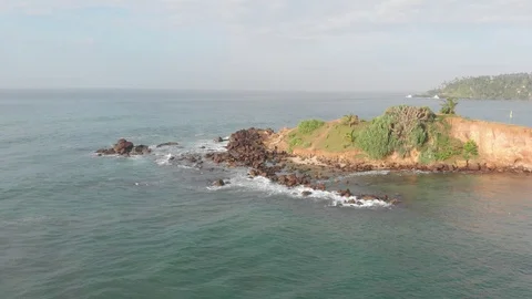 Island, rocks, wave, splash  Video stock 103324330