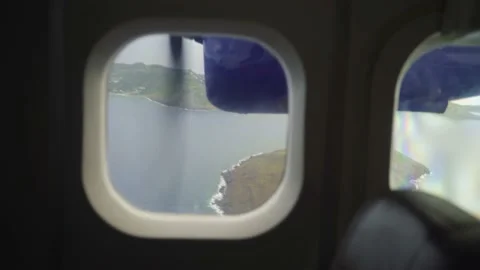 Island seen from inside small plane Stock Footage 168776856