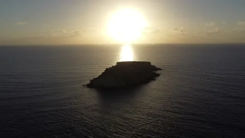Island With Sunrise/Sunset Behind Video stock 255705845