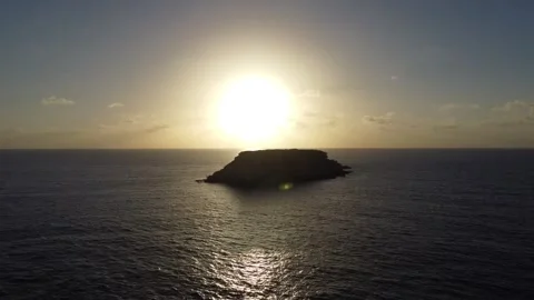 Island With Sunrise/Sunset Behind Video stock 255705872