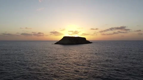 Island With Sunrise/Sunset Behind Video stock 255706688